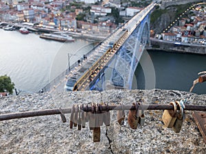 D.Luis bridge seen from the mountain of Serra do Pilar to the city of Porto.  Padlocks in the foreground.