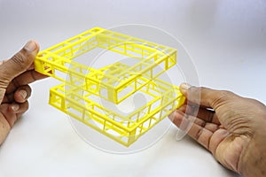 3D printed geo metrical shape object held in the hand on white background. Things printed using 3d printer machine photo