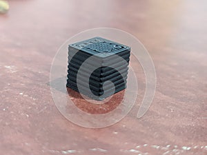 3D printed small black cube