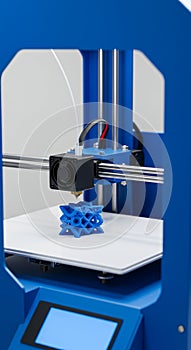 A 3D printer is in action, creating a complex geometric blue object. The printer has a