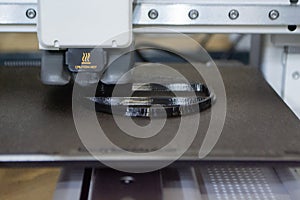 3D printer Working 3D printer process printing object molten black plastic