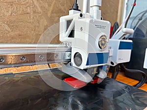 3d printer extruder creating an object layer by layer