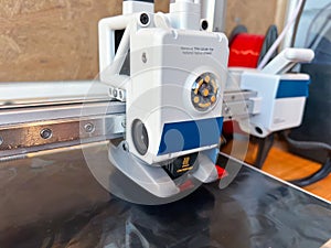 3d printer extruder creating an object layer by layer