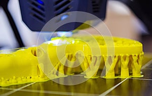 3D printer printing object close-up. Process creating three-dimensional model