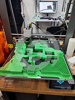 3D printer printing object close-up. Process creating three-dimensional model