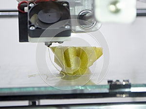 3D printer prints object Process of printing model on 3D printer. Model printed