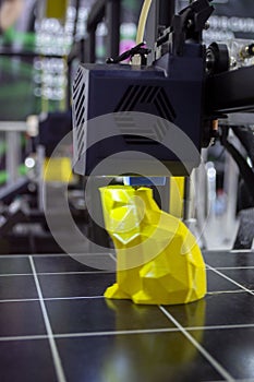 3D printer prints object Process of printing model on 3D printer. Model printed