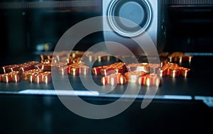 3D printer Working 3D printer process printing object molten orange plastic