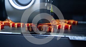 3D printer Working 3D printer process printing object molten orange plastic