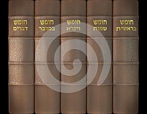 3D render of The five books of Moses in leather cover and golden