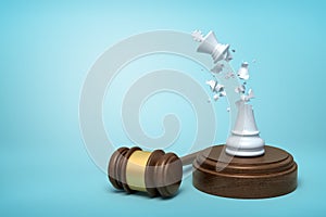 3d rendering of broken white chess king, its crumbs in air, standing on sounding block with gavel beside on light-blue photo