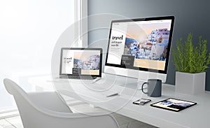 grey studio devices with travel website