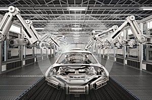 Robot assembly line in car factory photo