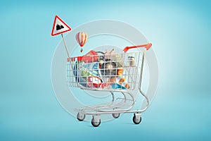 3d rendering of shopping cart filled with such things as an Earth globe, phone, iron ball, piggy bank, golden egg and