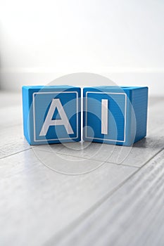 3D AI letters formed with small blue boxes photo