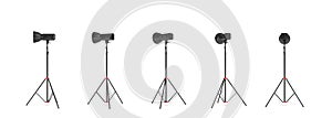 3d rendering of three lights with reflectors with the head turned down and up. photo