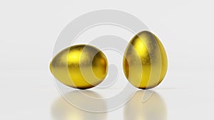 3D rendering, two golden eggs on white background