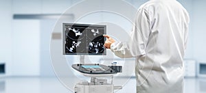 Ultrasound machine with sonographer in laboratory photo