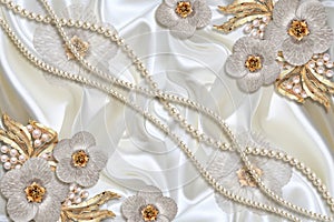 3D wallpaper texture, Jewelry flowers and white pearls on silk background.