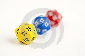 D20 yellow, blue and red dices for rpg, dnd or board games on light background