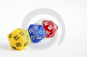 D20 yellow, blue and red dices for rpg, dnd or board games on light background