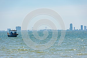 Da Nang city in silhouette with boat