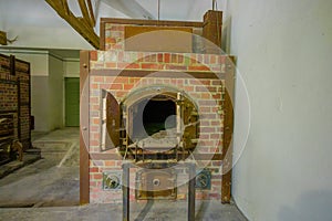 Dachau, Germany - July 30, 2015: Brick ovens inside crematorium building showing gruesome reality of what happened at