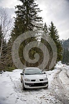 Dacia car parked at the edge of a mountain road 