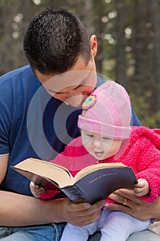 Dad and Baby Daughter Reading Bible