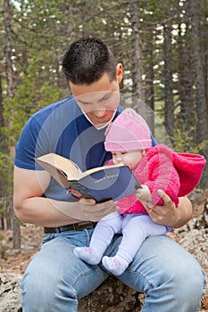 Dad and Baby Daughter Reading Bible