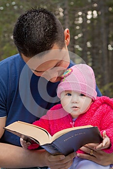 Dad and Baby Daughter Reading Bible