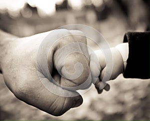 Dad and baby fist bump