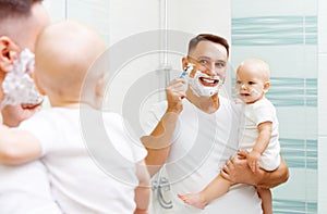 Dad and baby son shave photo
