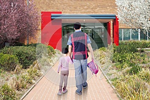 Dad and child arrive at school photo