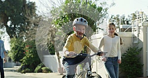 Dad, child and teaching bicycle ride for safety, helmet and outdoor street with sister. Cycling, childhood memory and