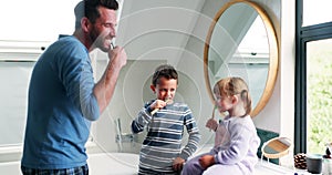 Dad, children and brushing teeth in bathroom for dental wellness, morning routine or teaching healthy habits. Family of