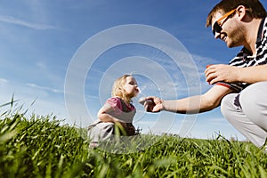 Dad and daughter blow bubbles