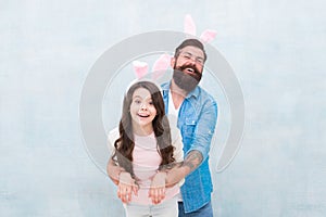 Dad and daughter bunny ears. Father and child celebrate easter. Better together. Spring holiday. Easter activities for