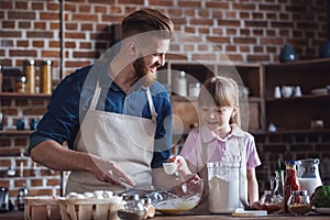 Dad and daughter cooking