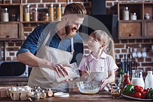 Dad and daughter cooking