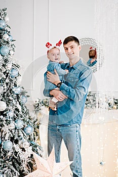 Dad and daughter. Happy New Year and Merry Christmas. Christmas decorated interior. The concept of family winter holiday