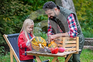 Dad and daughter spending time on a farm sorting the vegetables