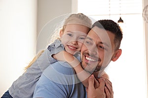 Dad and daughter spending time at home. Happy Father`s Day