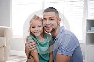 Dad and daughter spending time at home. Happy Father`s Day