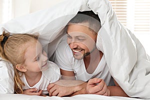 Dad and daughter spending time at home. Happy Father`s Day