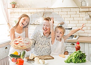 Dad with daughters preparing pizza