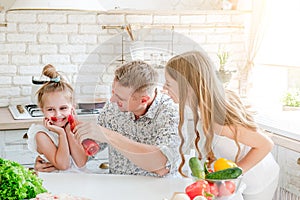 Dad with daughters preparing pizza