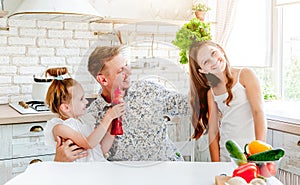 Dad with daughters preparing pizza