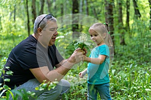 Dad gives the landy to a young daughter photo