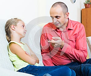 Dad giving instructions to child
